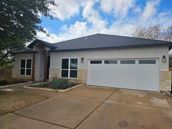 Completed Timberwood home exterior with new siding and garage